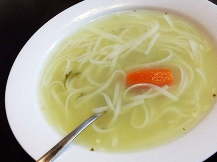 Steaming Vegetable Soup with Wide Rice Noodles